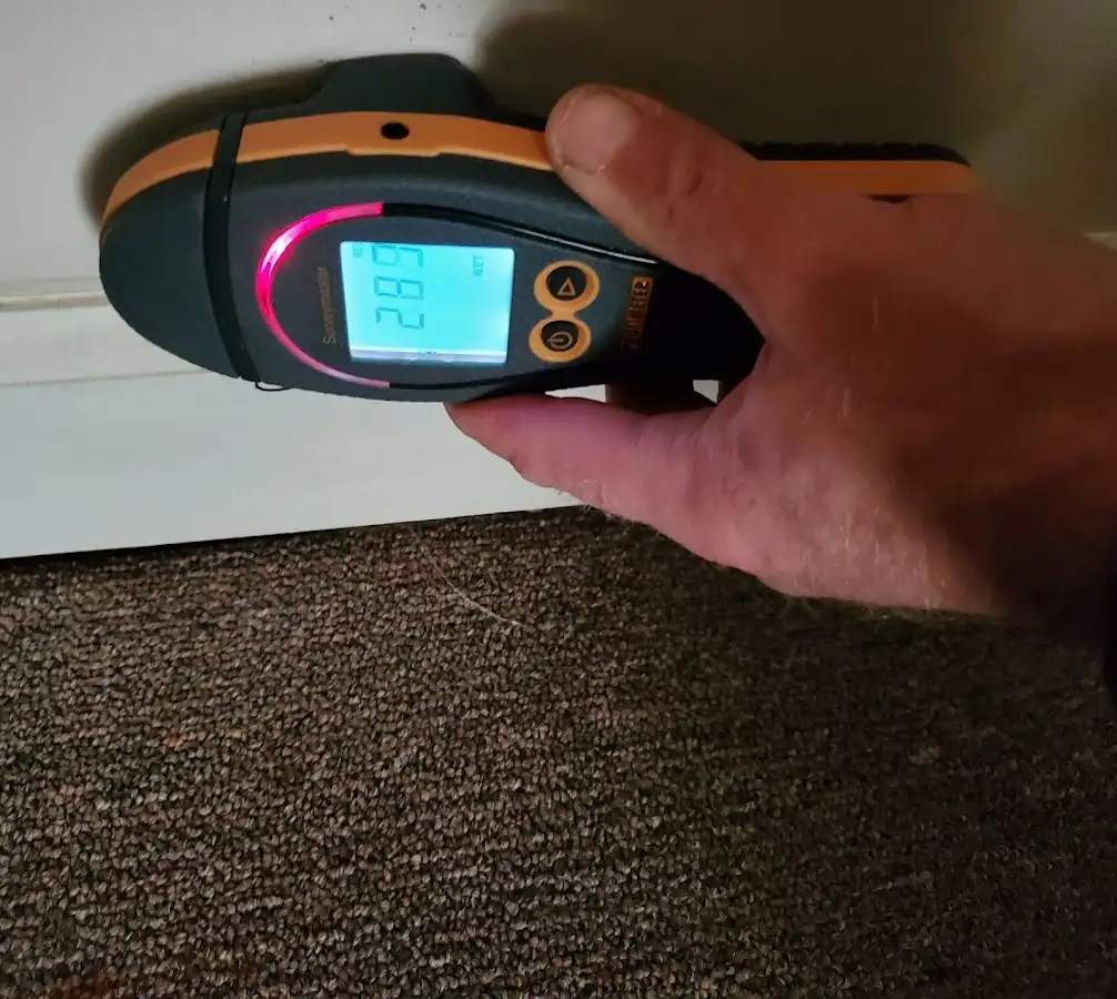 Moisture detection at baseboard during Storm Damage Restoration in East Coventry